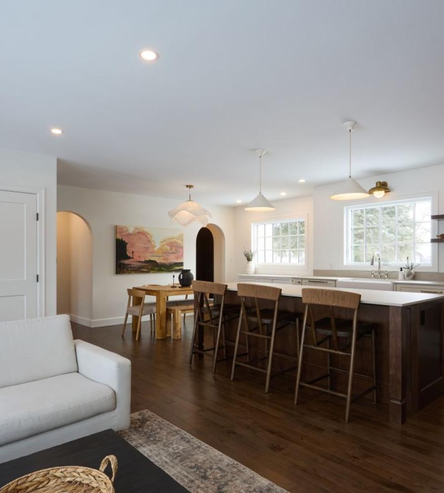 large kitchen island with natural light and cozy barstools