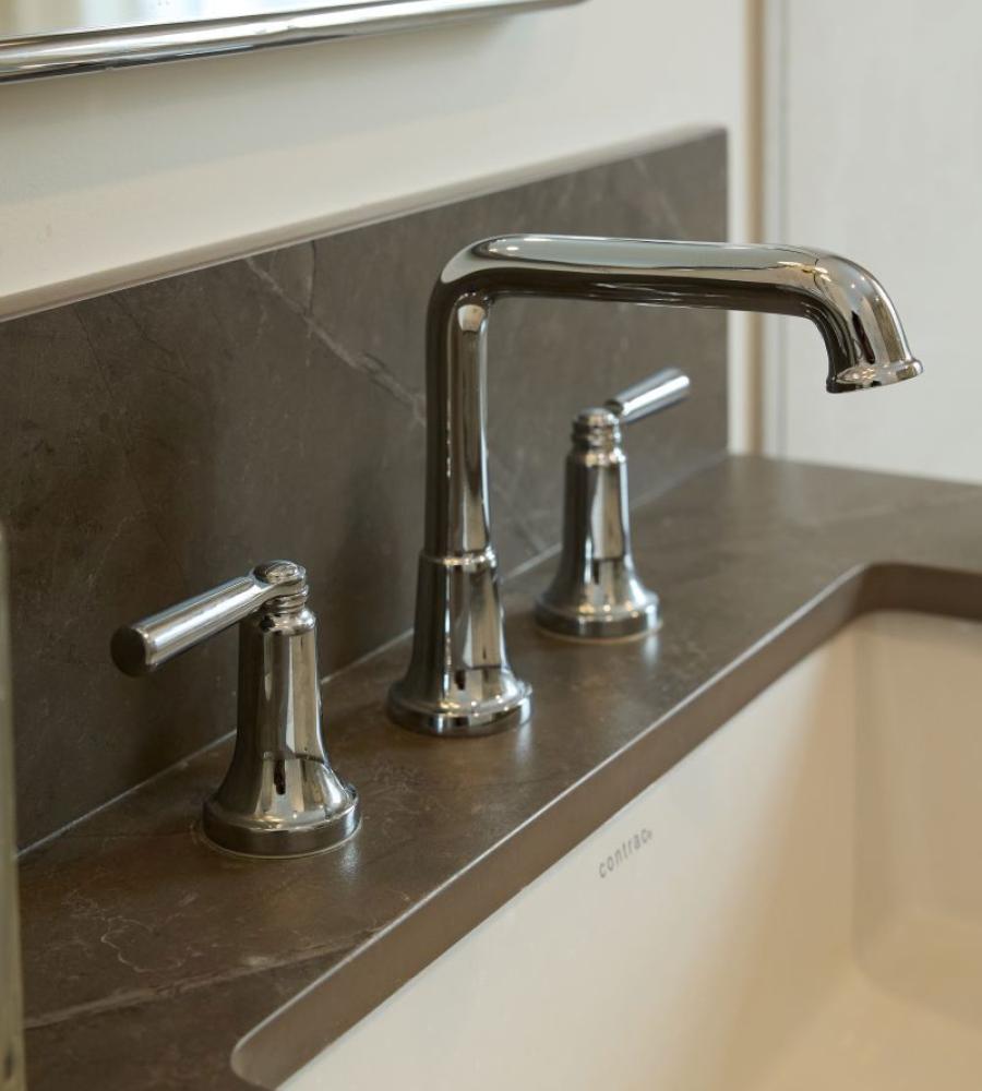 Detailed bathroom sink with rich countertops